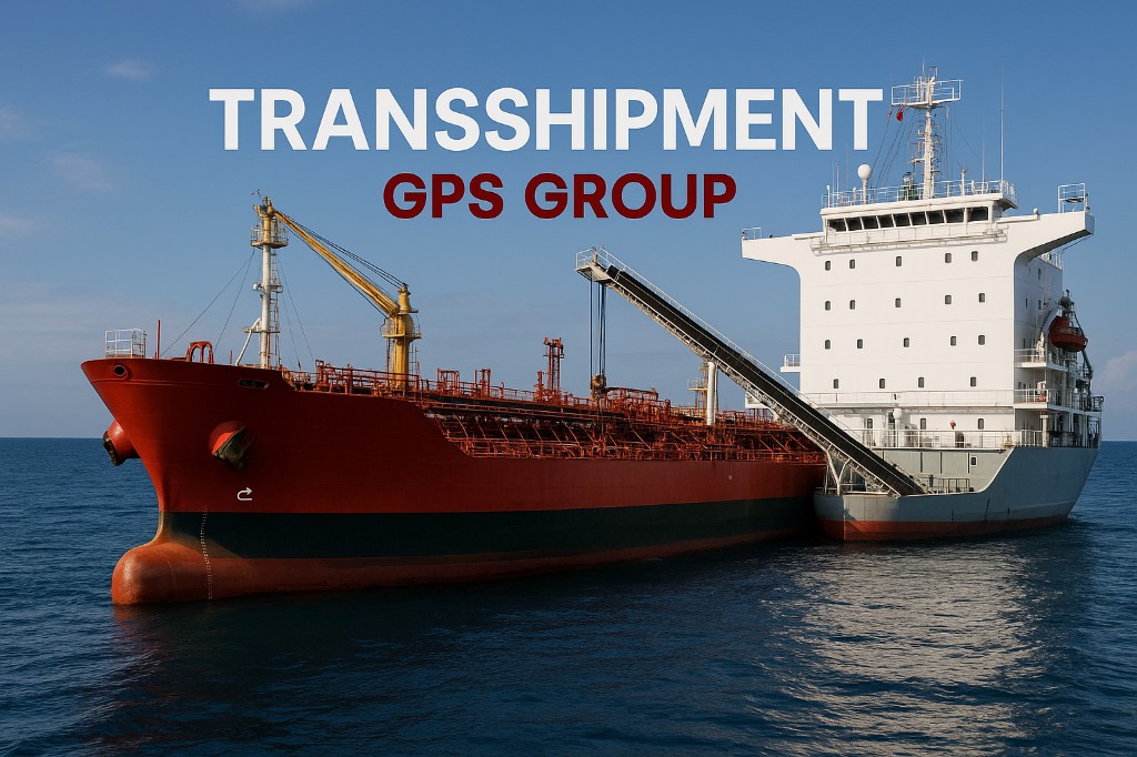A red tanker and a white vessel alongside during a transshipment at sea.